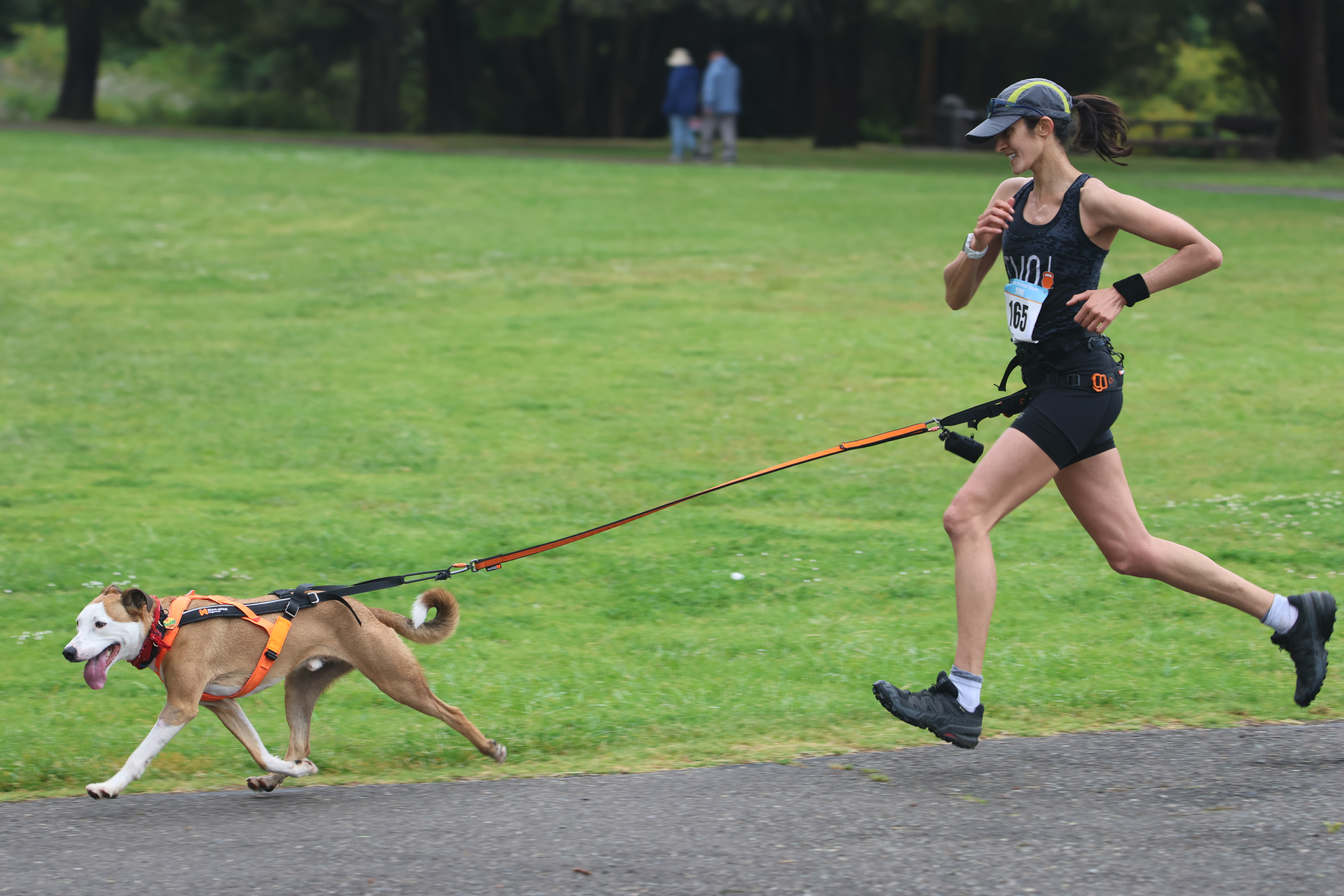 Maya running canicross with her dog Sirius